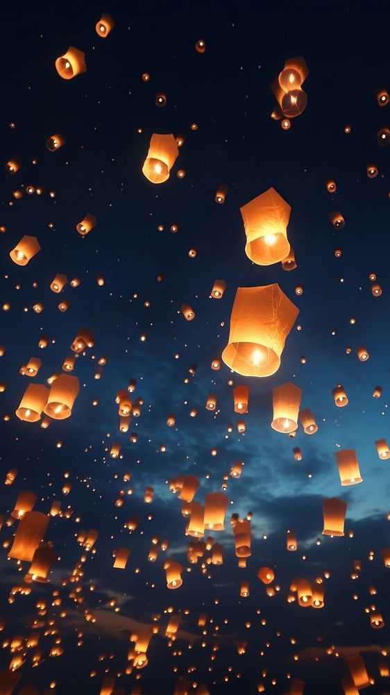 Floating lanterns in night sky. AI generated Image by rawpixel.