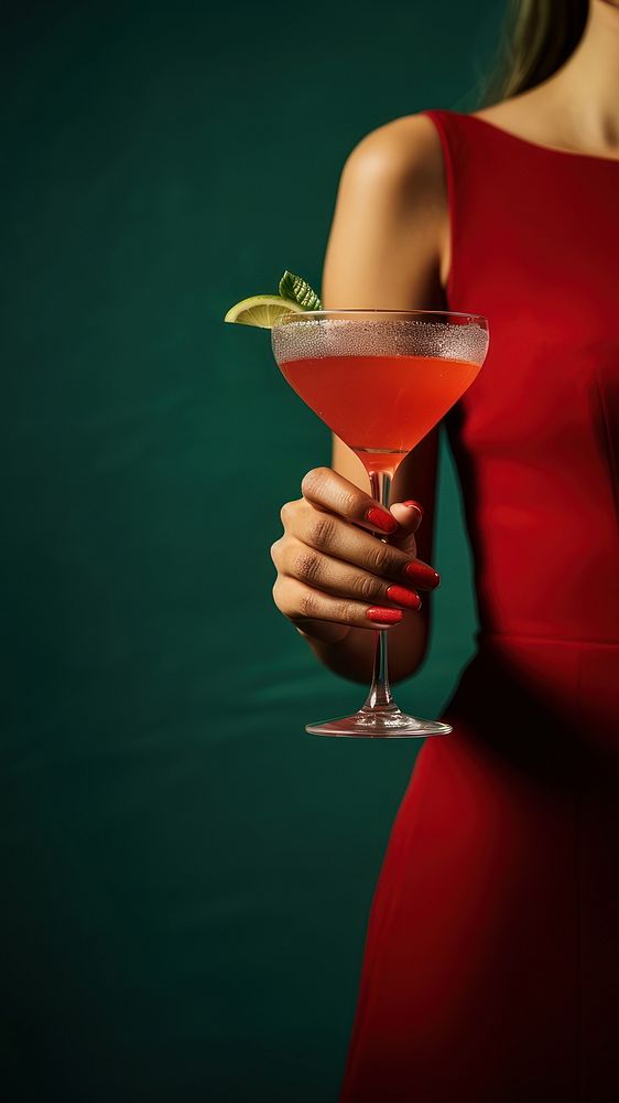 photo of woman hand holding red cocktail. AI generated Image by rawpixel. 