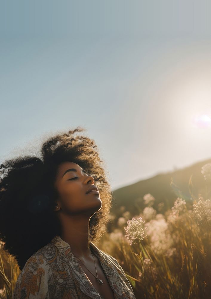 photo of happy black woman in a meadow. AI generated Image by rawpixel. 