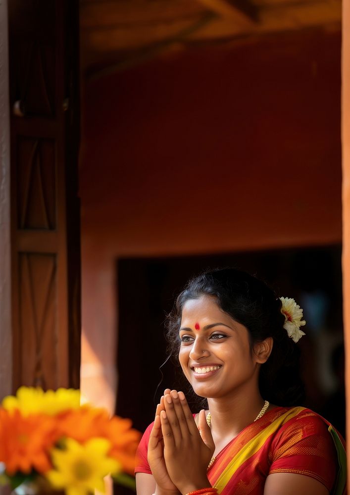 Sri Lankan woman performing a traditional welcoming gesture.  