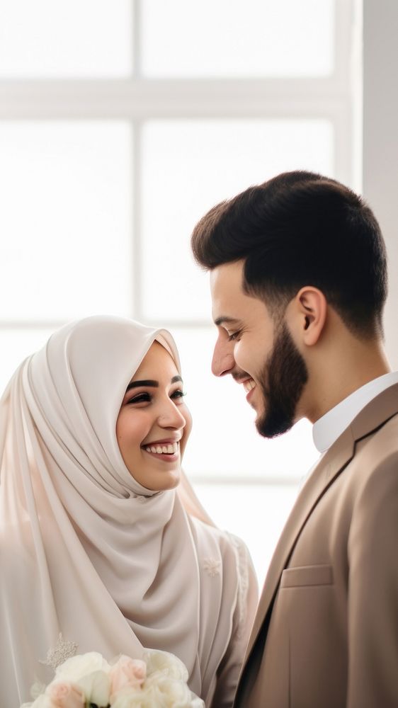 Cropped shot of muslim couple newlywed looking at each other, happy. 