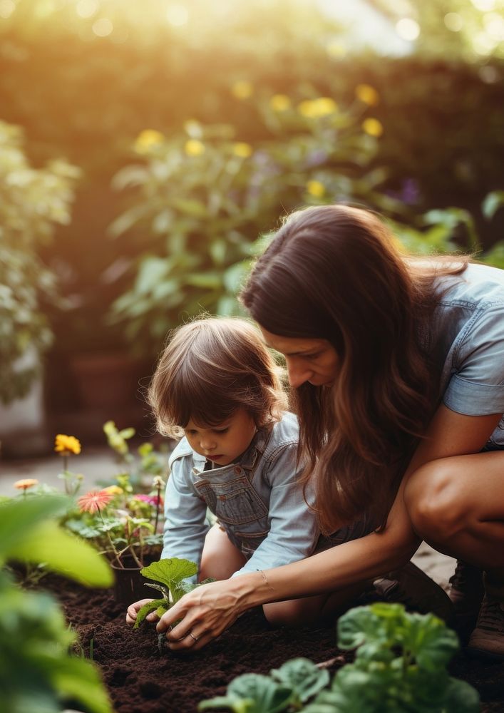 A photo of  mother teaching her child how to dig in the backyard garden. AI generated Image by rawpixel. 