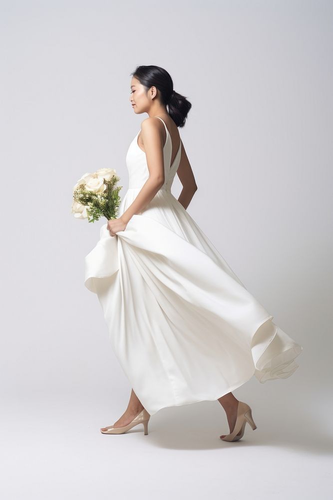 A asian bride holding flowers dress footwear fashion. AI generated Image by rawpixel.