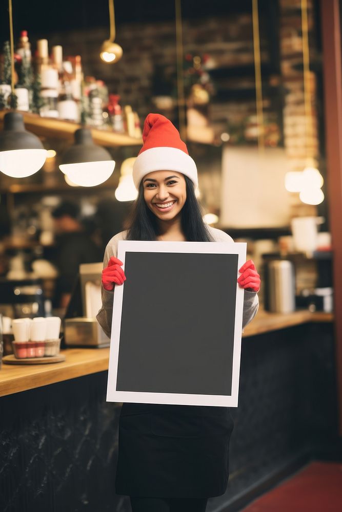 Barista wearing santa hat portrait holding female. AI generated Image by rawpixel.