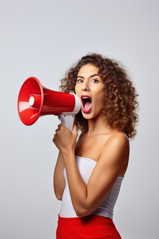 A woman holding a megaphone shouting face white background. AI generated Image by rawpixel.
