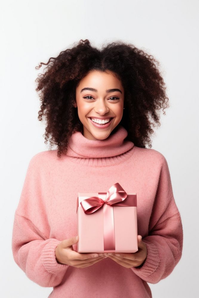 Girl holding Christmas gift christmas smile happy. AI generated Image by rawpixel.