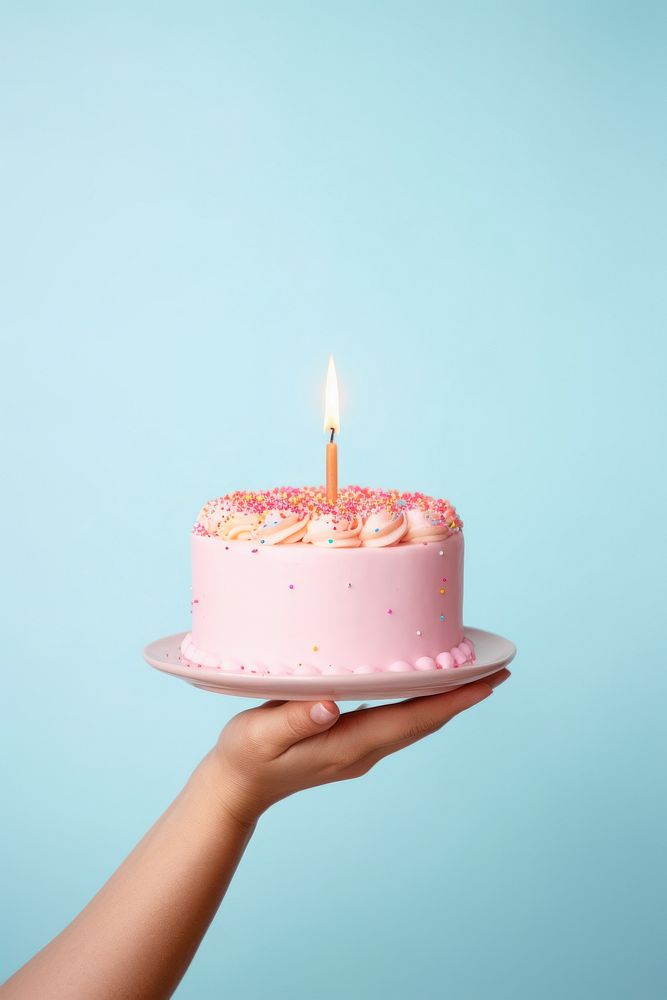 People hand holding minimal cute birthday cake dessert candle food. AI generated Image by rawpixel.