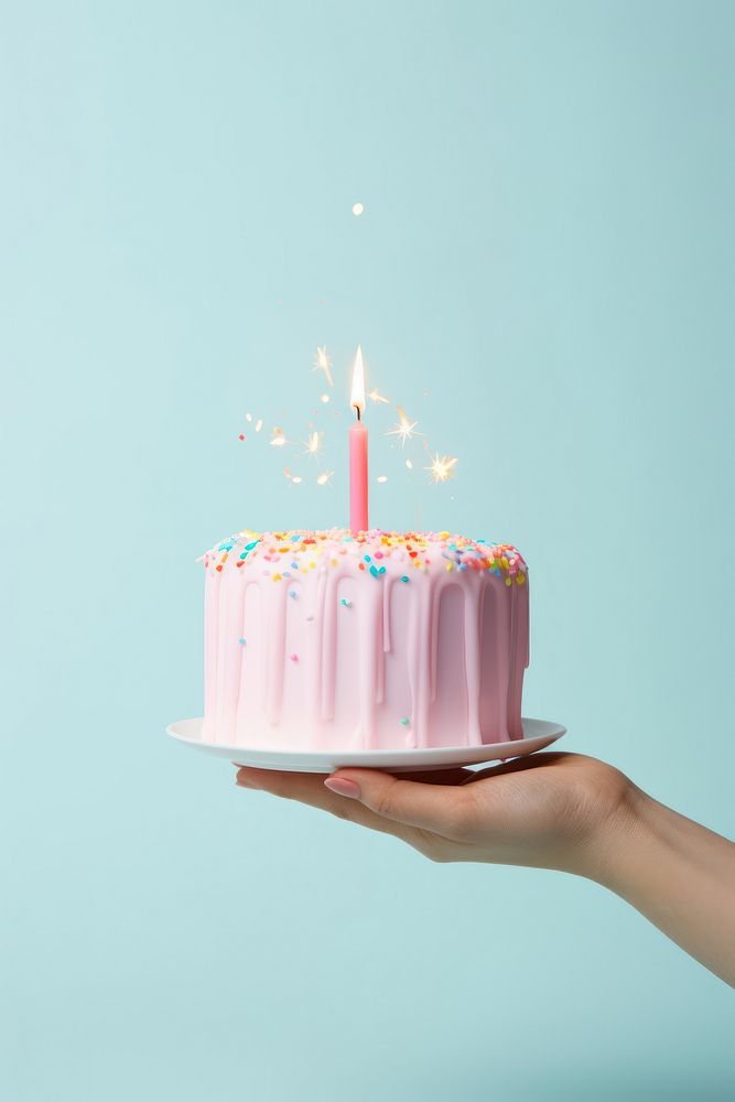 People hand holding minimal cute birthday cake dessert candle party. 