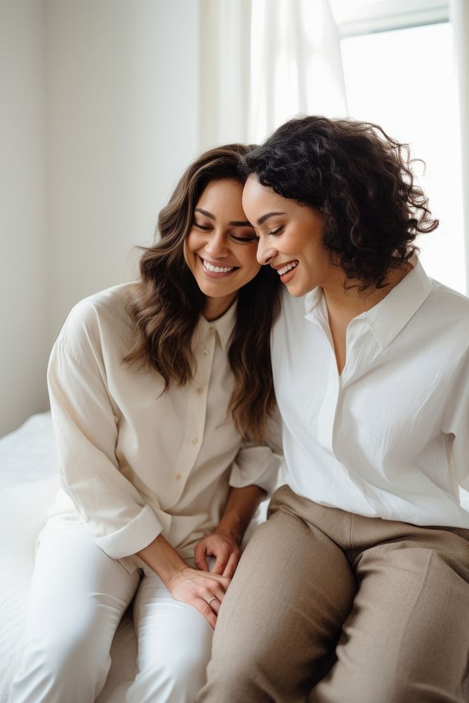 Diverse female couple laughing adult happy. AI generated Image by rawpixel.