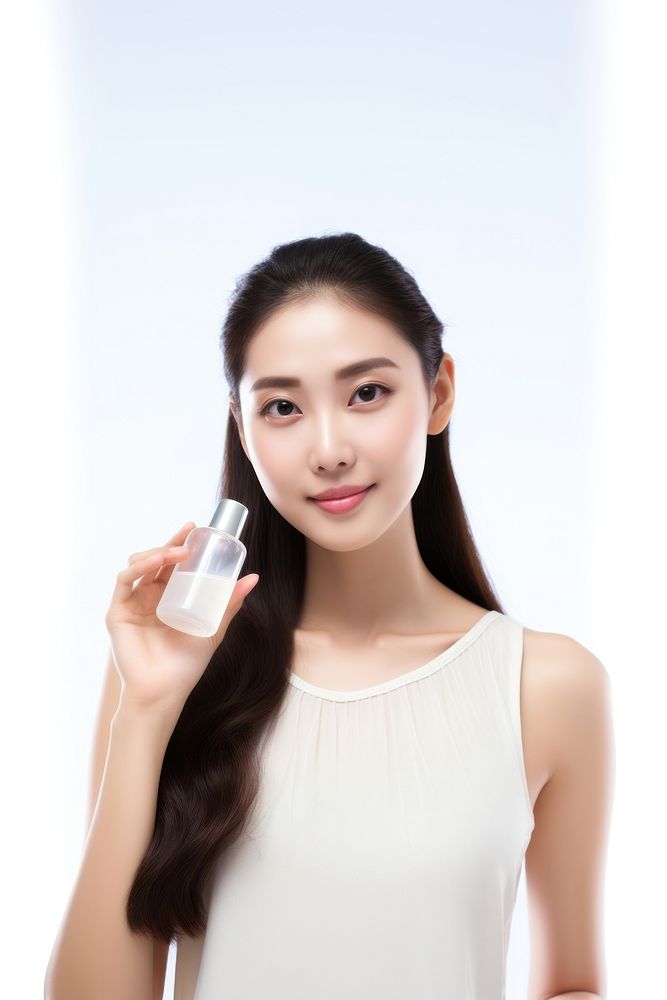 Cosmetics portrait holding bottle. 