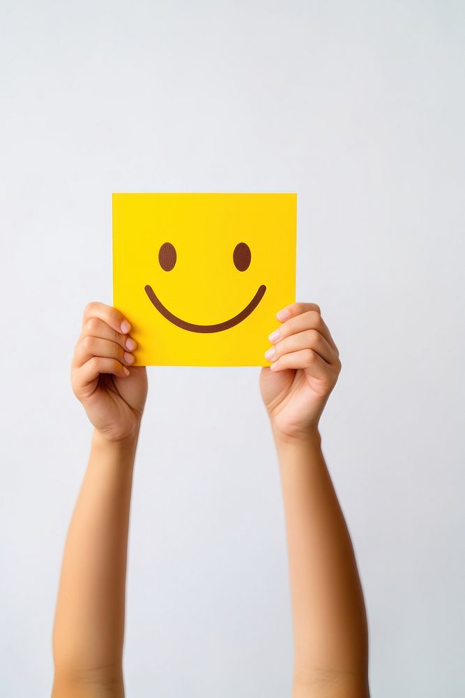 Smile face paper yellow hand. AI generated Image by rawpixel.
