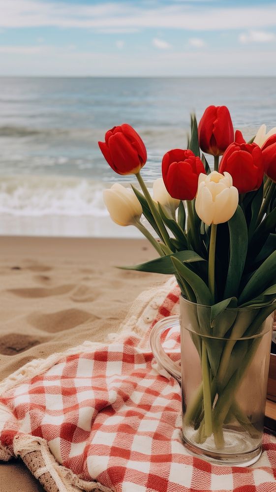 Beach picnic outdoors horizon flower. AI generated Image by rawpixel.