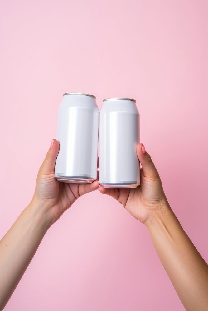 White cans holding hand refreshment. AI generated Image by rawpixel.