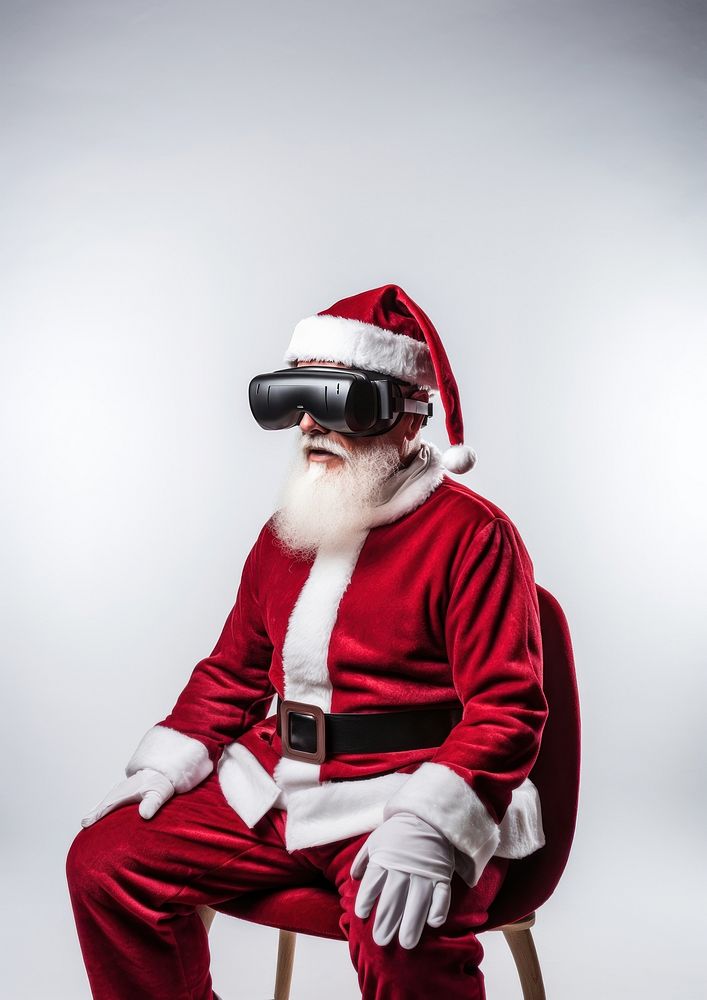 A Santa Claus wearing a vr headset christmas photo santa claus. AI generated Image by rawpixel.
