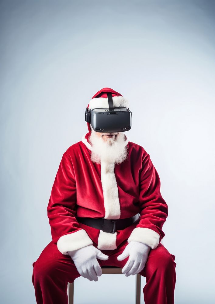 A Santa Claus wearing a vr headset christmas santa claus celebration. AI generated Image by rawpixel.