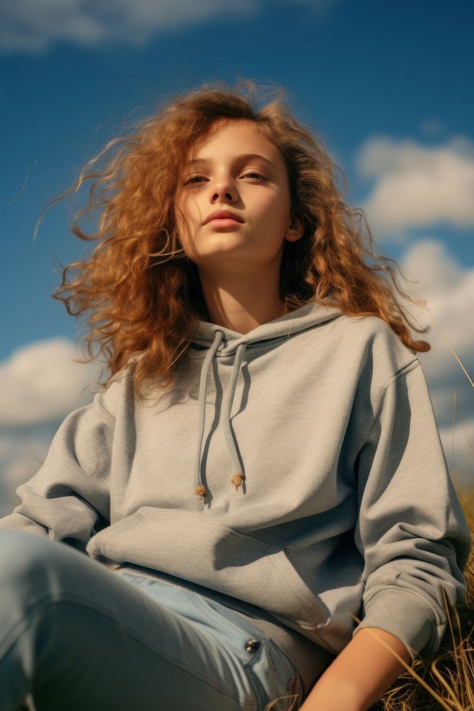 Young girl relaxing outdoors sweatshirt portrait adult. AI generated Image by rawpixel.