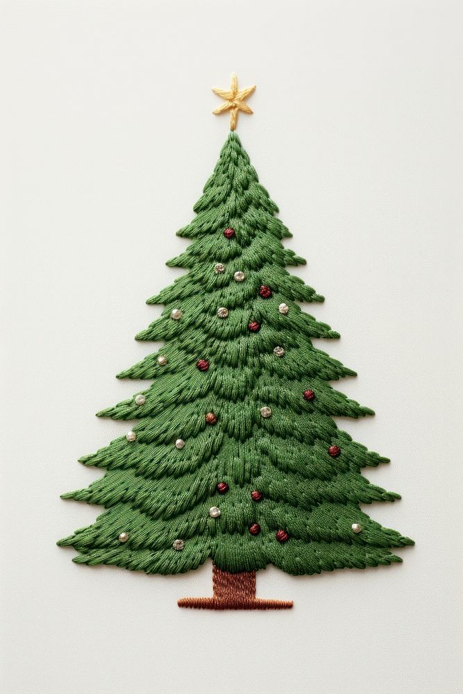 A christmas tree embroidery nature plant pine. AI generated Image by rawpixel.