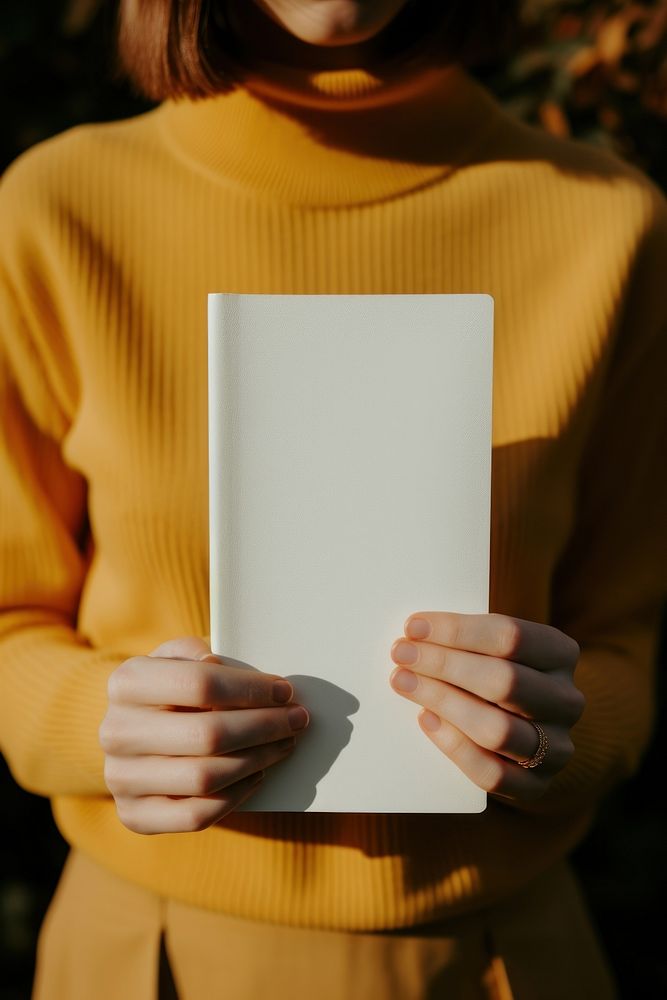 Hand holding white notebook publication person adult. AI generated Image by rawpixel.