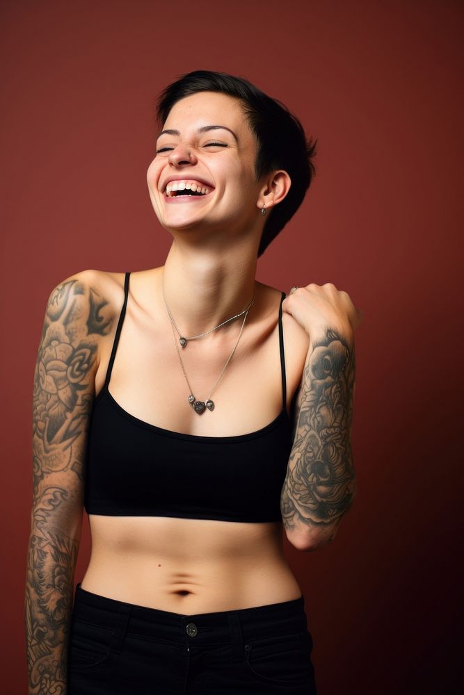 Young woman tattoo laughing necklace. AI generated Image by rawpixel.