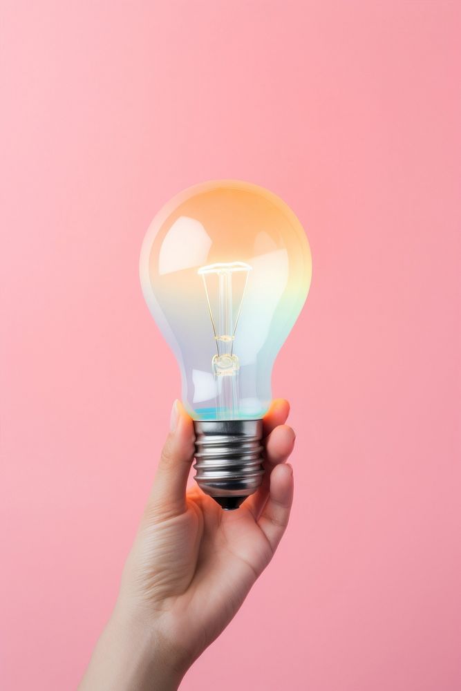 Hand holding a big lightbulb electricity illuminated innovation. AI generated Image by rawpixel.