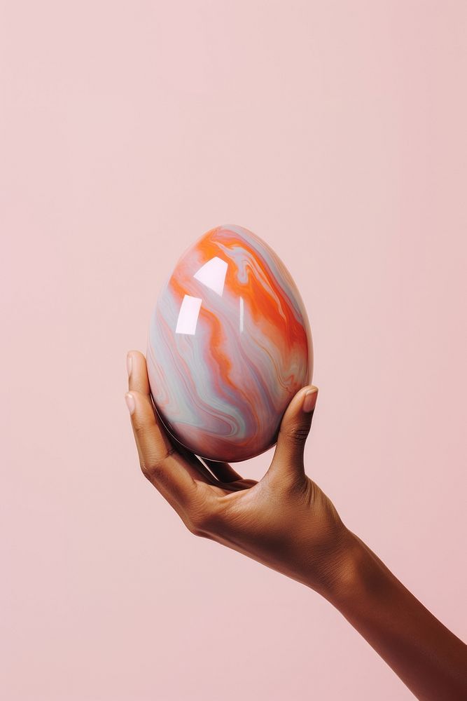 Hand holding easter egg skating finger sphere. AI generated Image by rawpixel.
