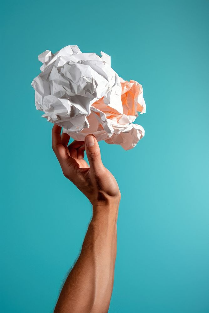 Hand holding small crumple paper ball art creativity crumpled. AI generated Image by rawpixel.