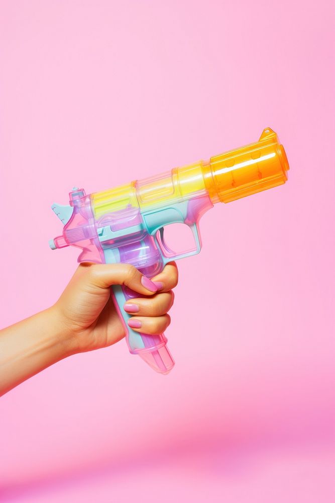 Hand holding water gun toy weapon weaponry handgun. AI generated Image by rawpixel.