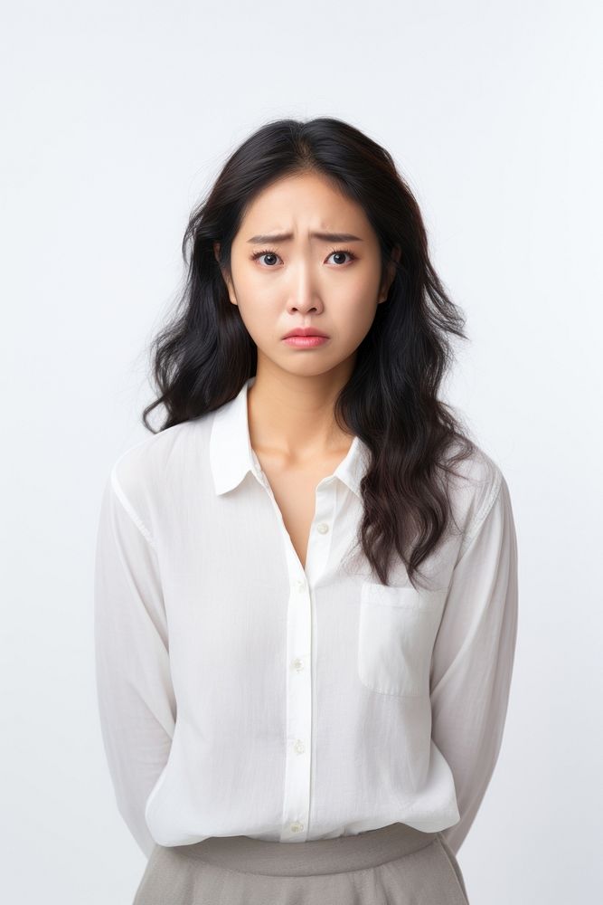 A cute asian woman looks sad portrait sadness blouse. AI generated Image by rawpixel.