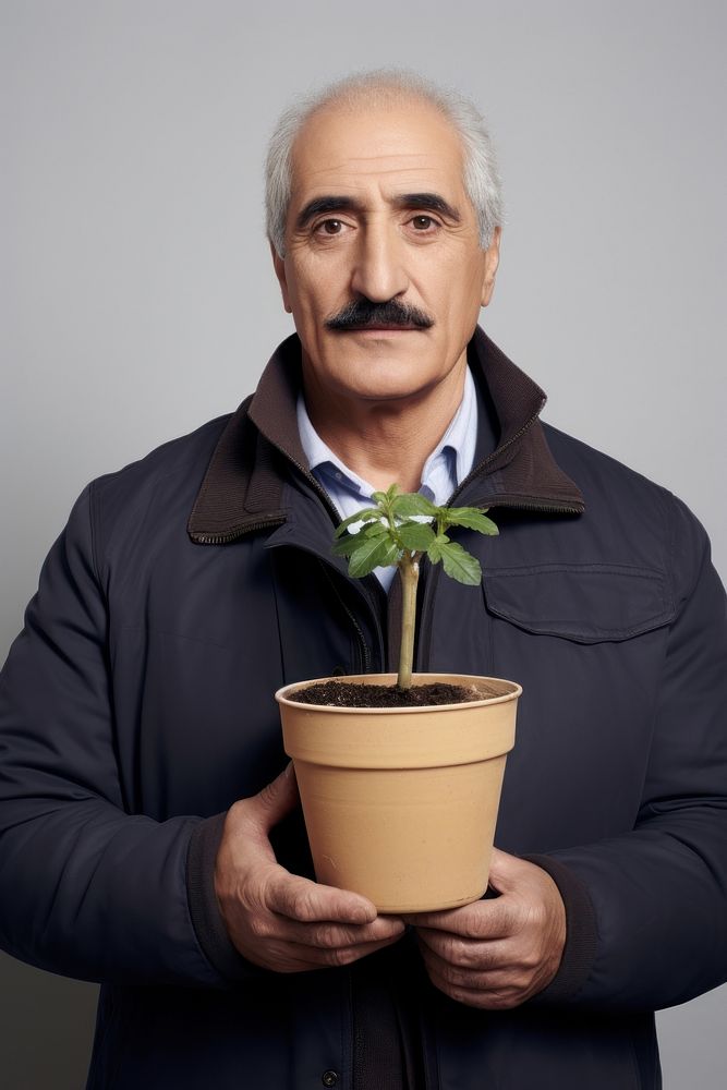 A gardener senior man portrait plant holding. AI generated Image by rawpixel.