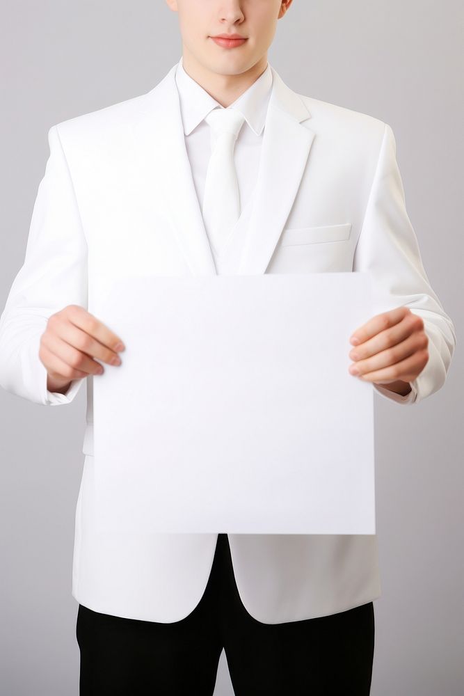 A groom wearing white suit portrait holding tuxedo. AI generated Image by rawpixel.