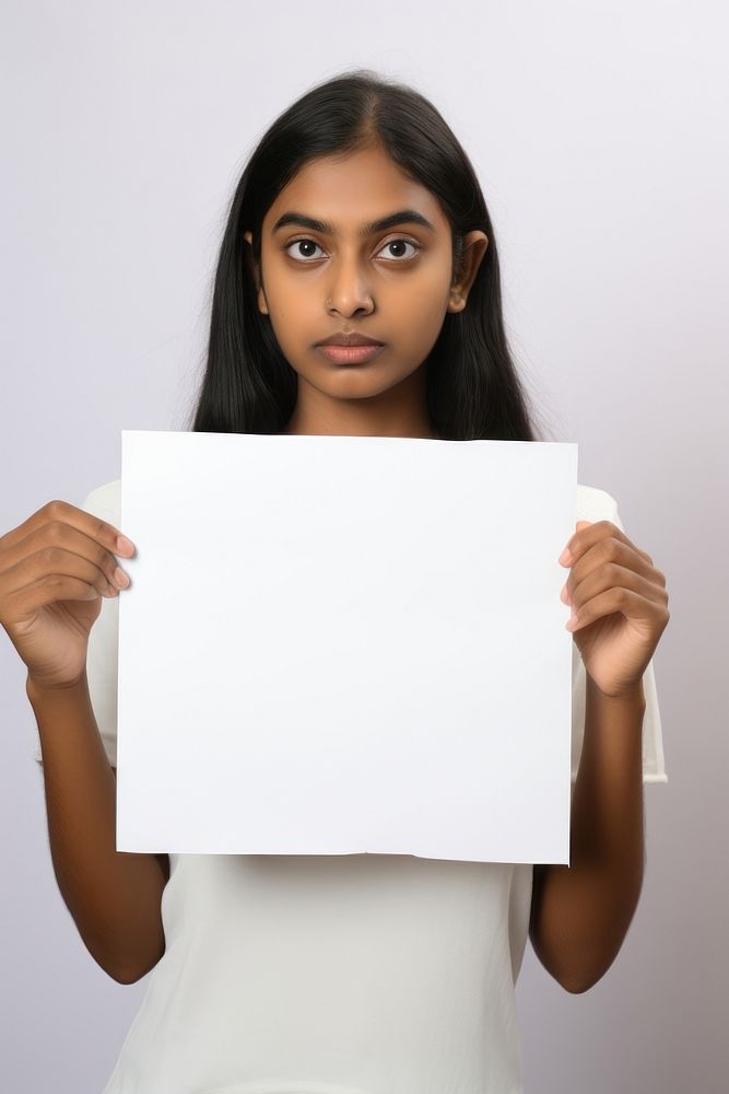 A Indian woman portrait holding paper. AI generated Image by rawpixel.