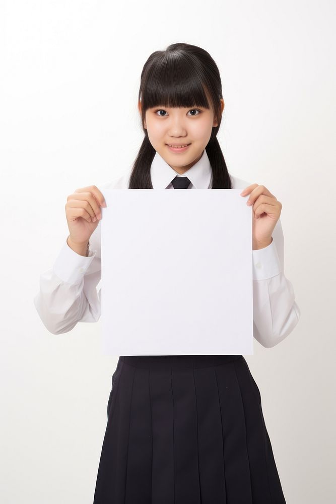 A japan student uniform girl portrait holding paper. AI generated Image by rawpixel.