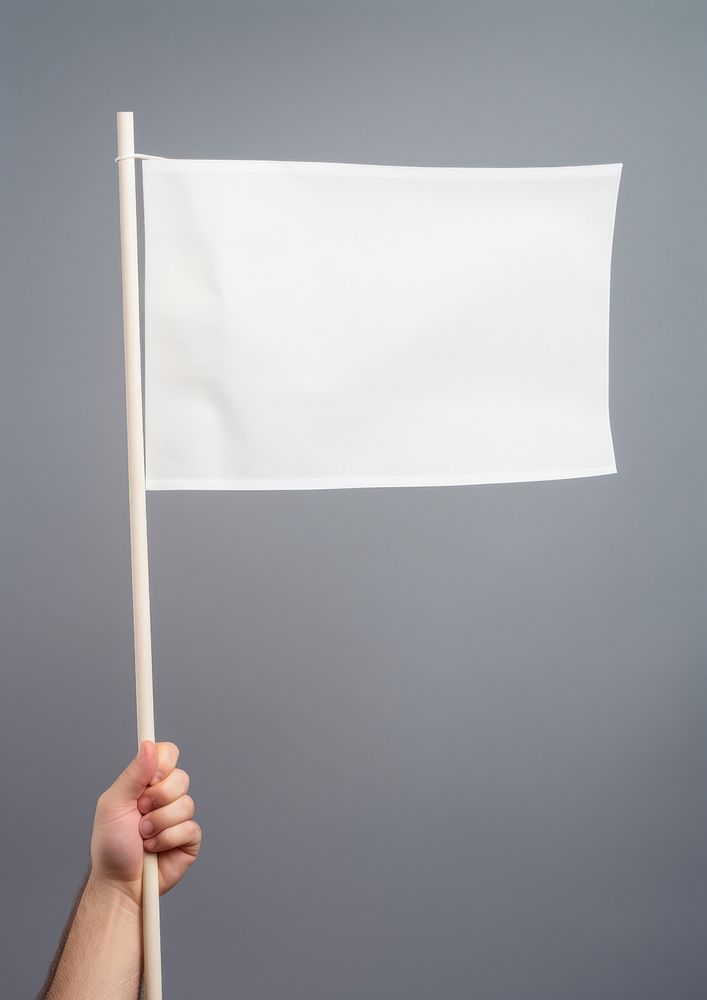 A man hand holding a blank white flag patriotism textile paper. AI generated Image by rawpixel.