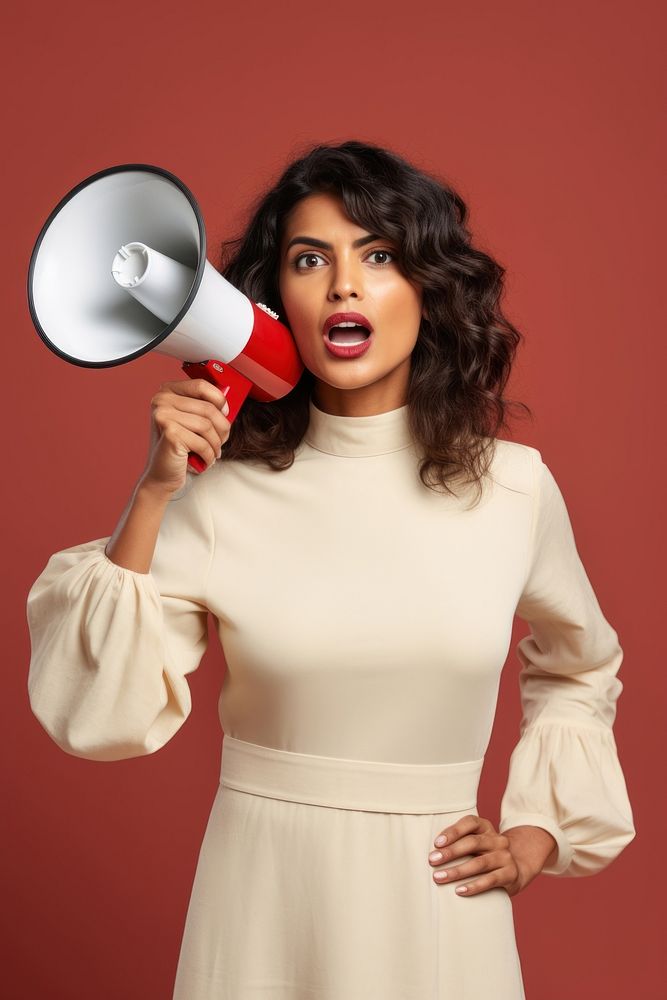 A Young Indian woman holding a megaphone portrait adult photo. AI generated Image by rawpixel.