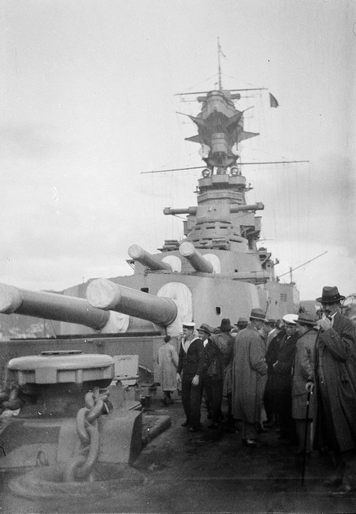 [Crowds on deck of a battleship in Wellington harbour] (1920s-1930s) by Roland Searle.
