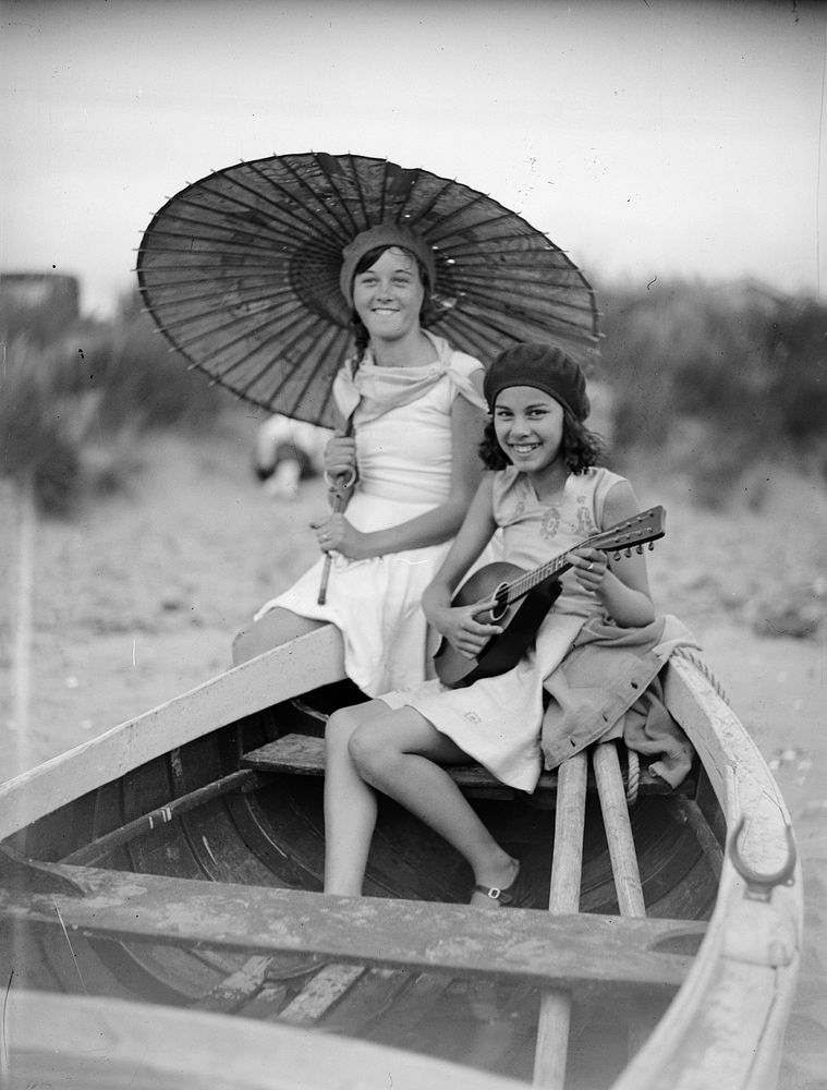 Two girls in boat (circa 1920) by Leslie Adkin.