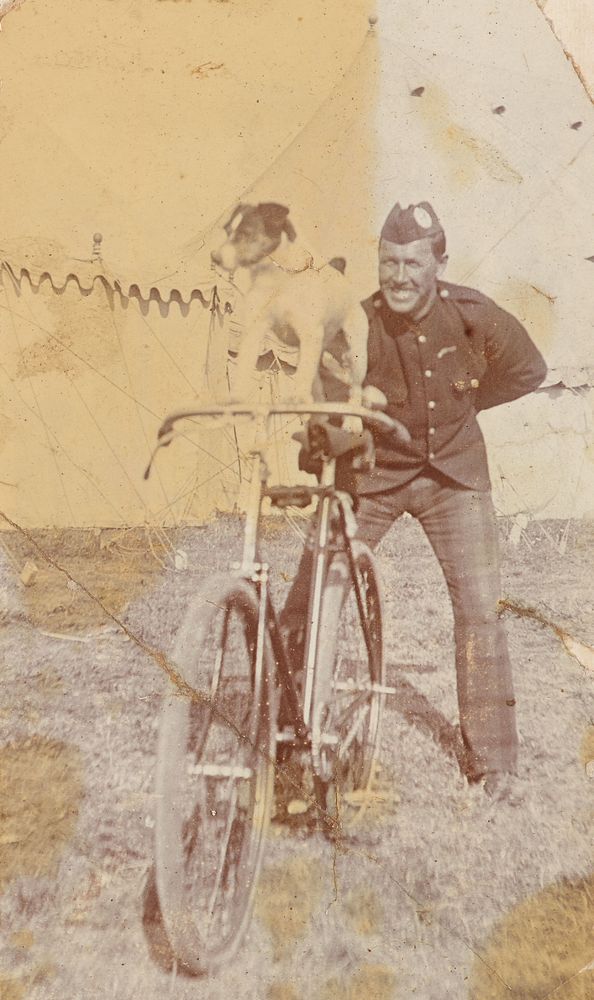 Fort George 1902, Cameron Highlanders Camp. 'Sparkie' on bike.  From the album: Photograph album of Major J.M. Rose, 1st…