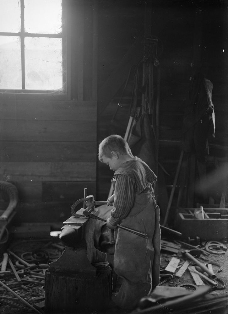 Blacksmith's Apprentice (circa 1910) by Fred Brockett.