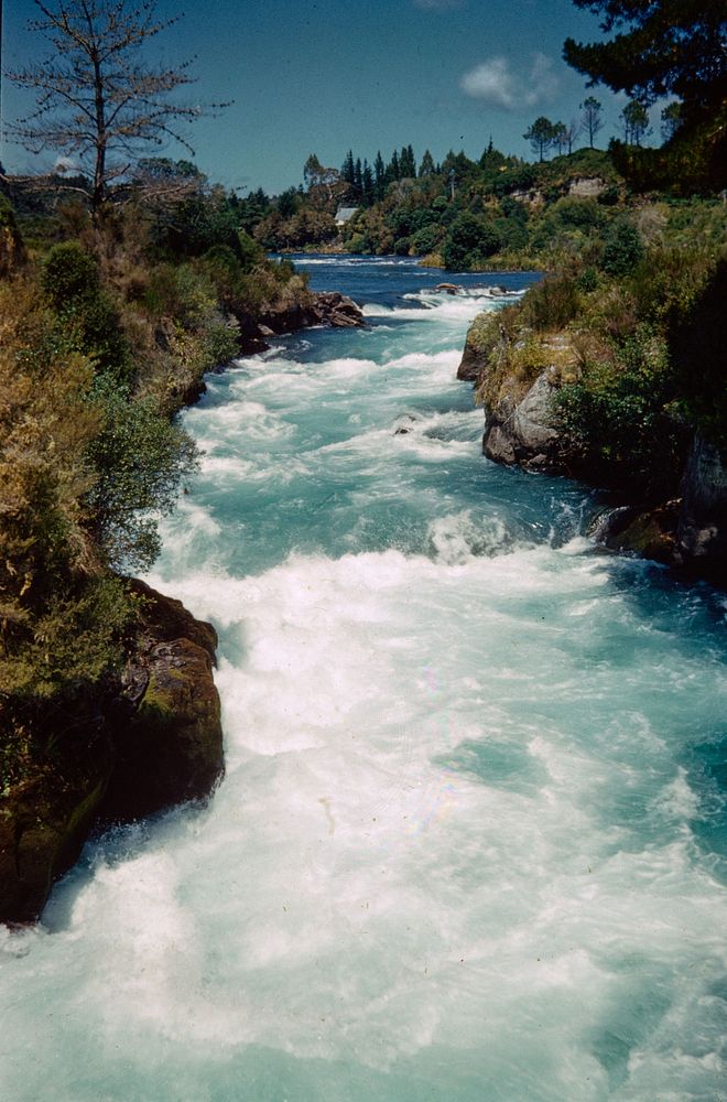 Rapids in the small canyon above Huka Falls - from suspension bridge (08 February 1960) by Leslie Adkin.