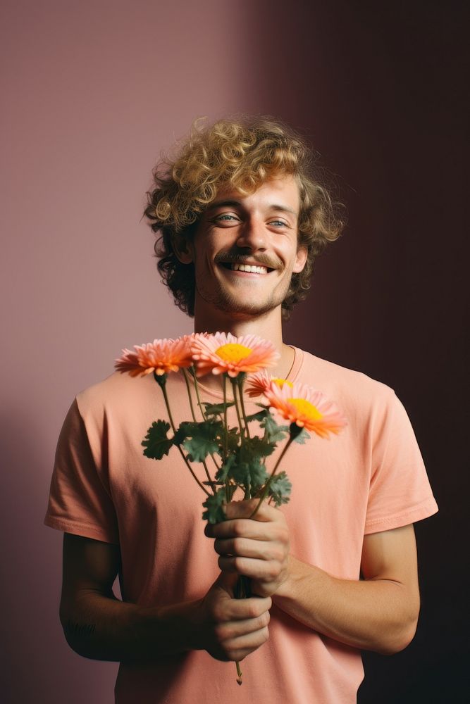 A man smiling holding a flowers portrait smile adult. AI generated Image by rawpixel.