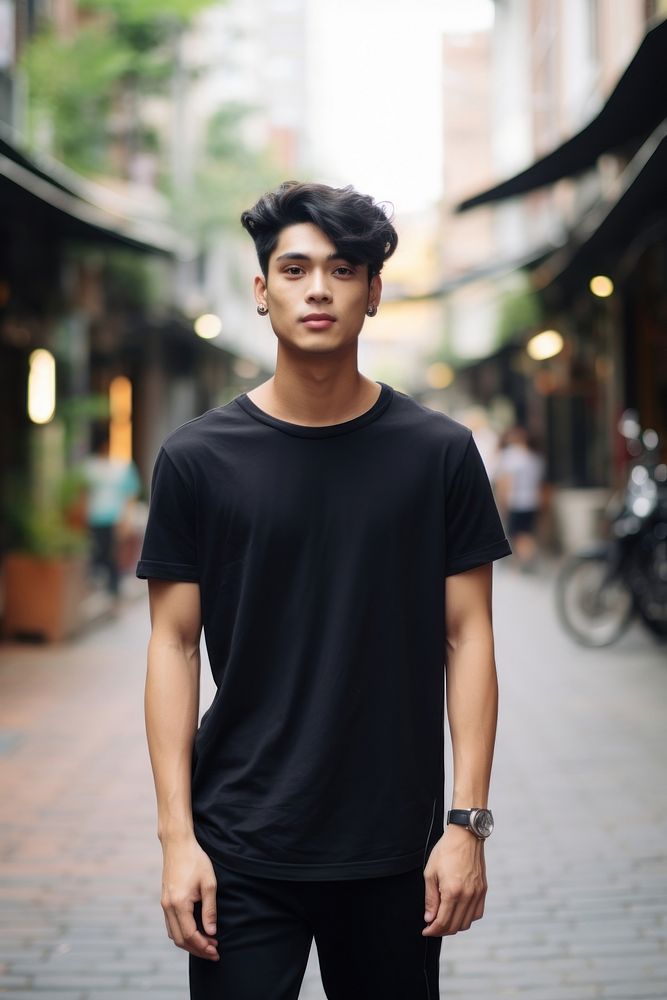 Thai teenager wearing black t-shirt walking photography portrait street. AI generated Image by rawpixel.
