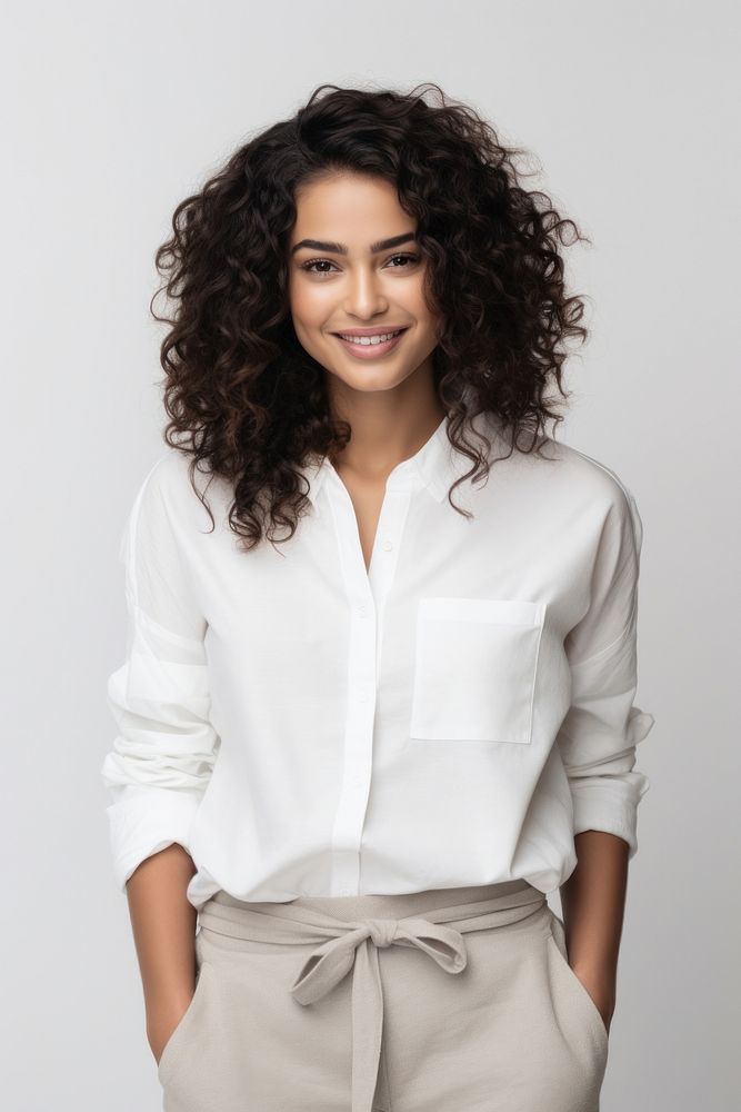 Woman in the outfit white shirt in natural posed blouse adult smile. AI generated Image by rawpixel.