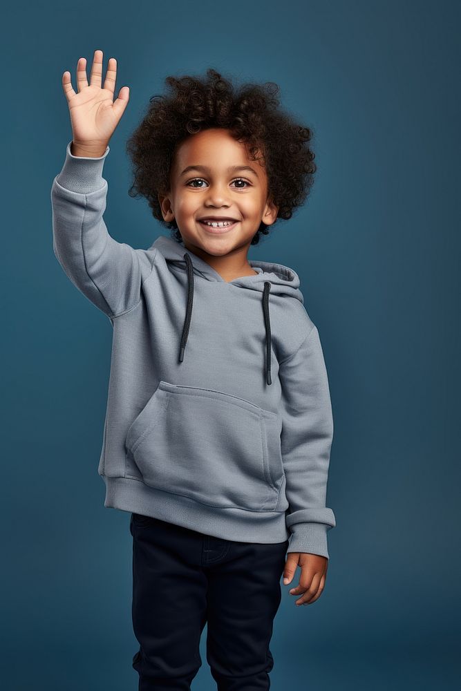 Black kid standing raising hand sweatshirt portrait smile. AI generated Image by rawpixel.