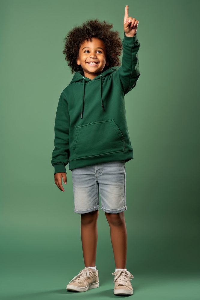 Black kid standing raising hand sweatshirt footwear portrait. AI generated Image by rawpixel.