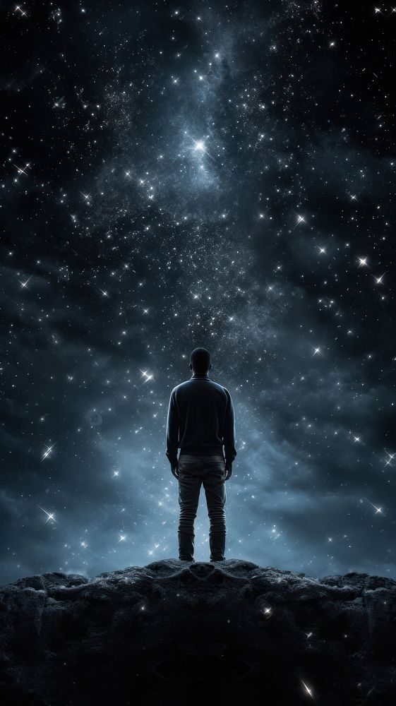 A man standing silhouette astronomy universe. 