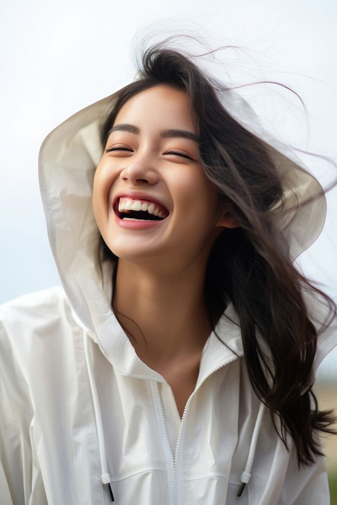 Vietnamese woman laughing outdoors adult. AI generated Image by rawpixel.