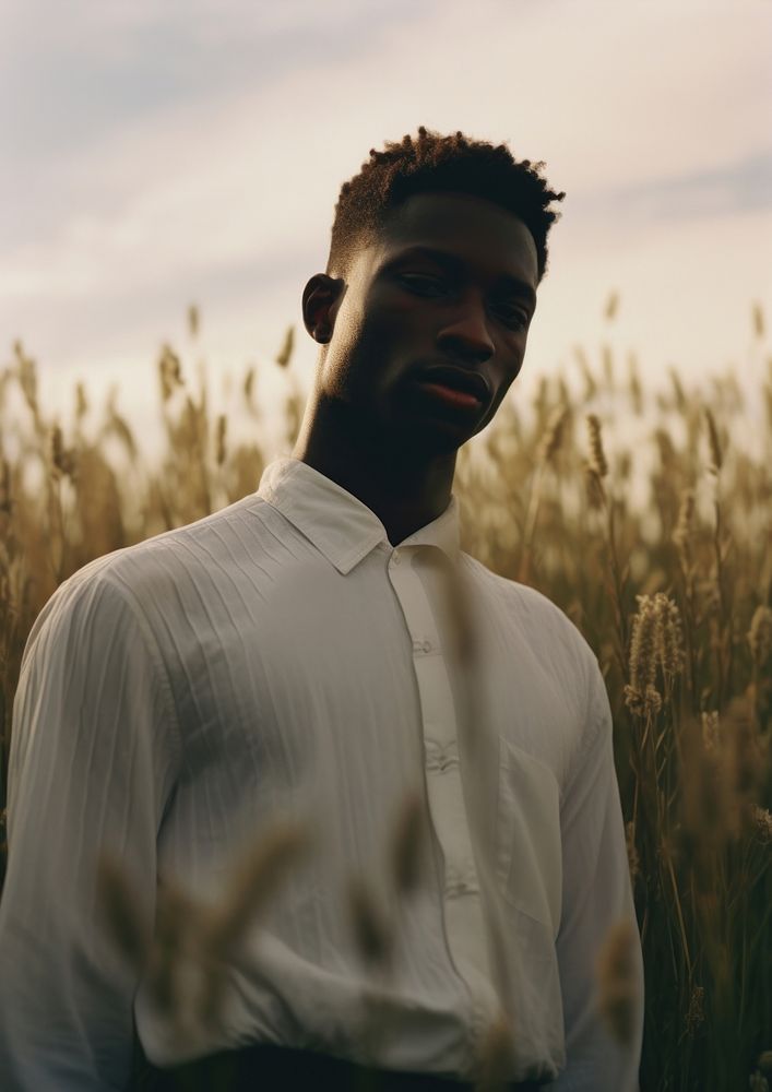 Black man with minimal white shirt portrait standing nature. AI generated Image by rawpixel.