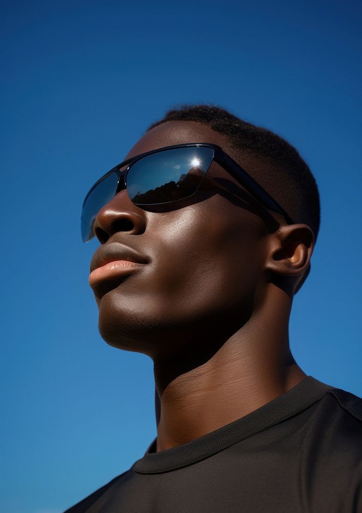 Black man wear fashionable black sunglasses adult blue sky. AI generated Image by rawpixel.