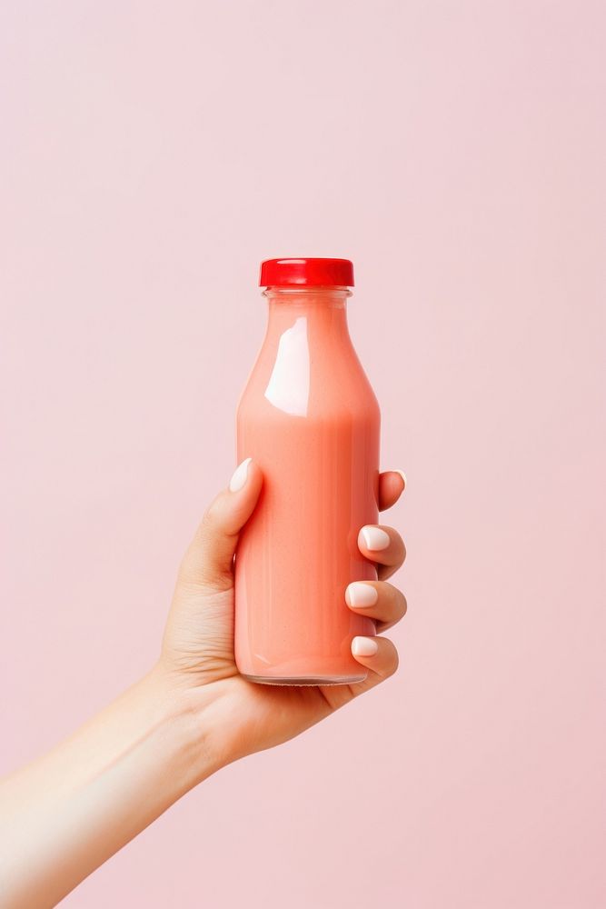 Fruit smoothie holding bottle drink. AI generated Image by rawpixel.
