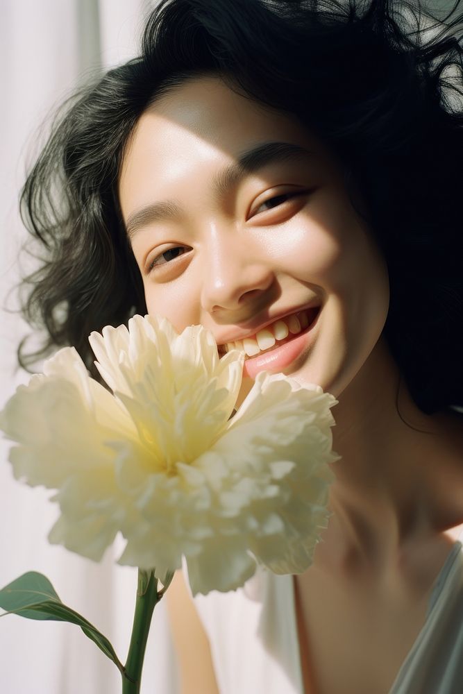 East Asian woman holding flower portrait plant white. AI generated Image by rawpixel.